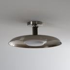 A Clérachic nickel ceiling light with its white diffuser unlit, showing the ribbed stem and brushed dish.