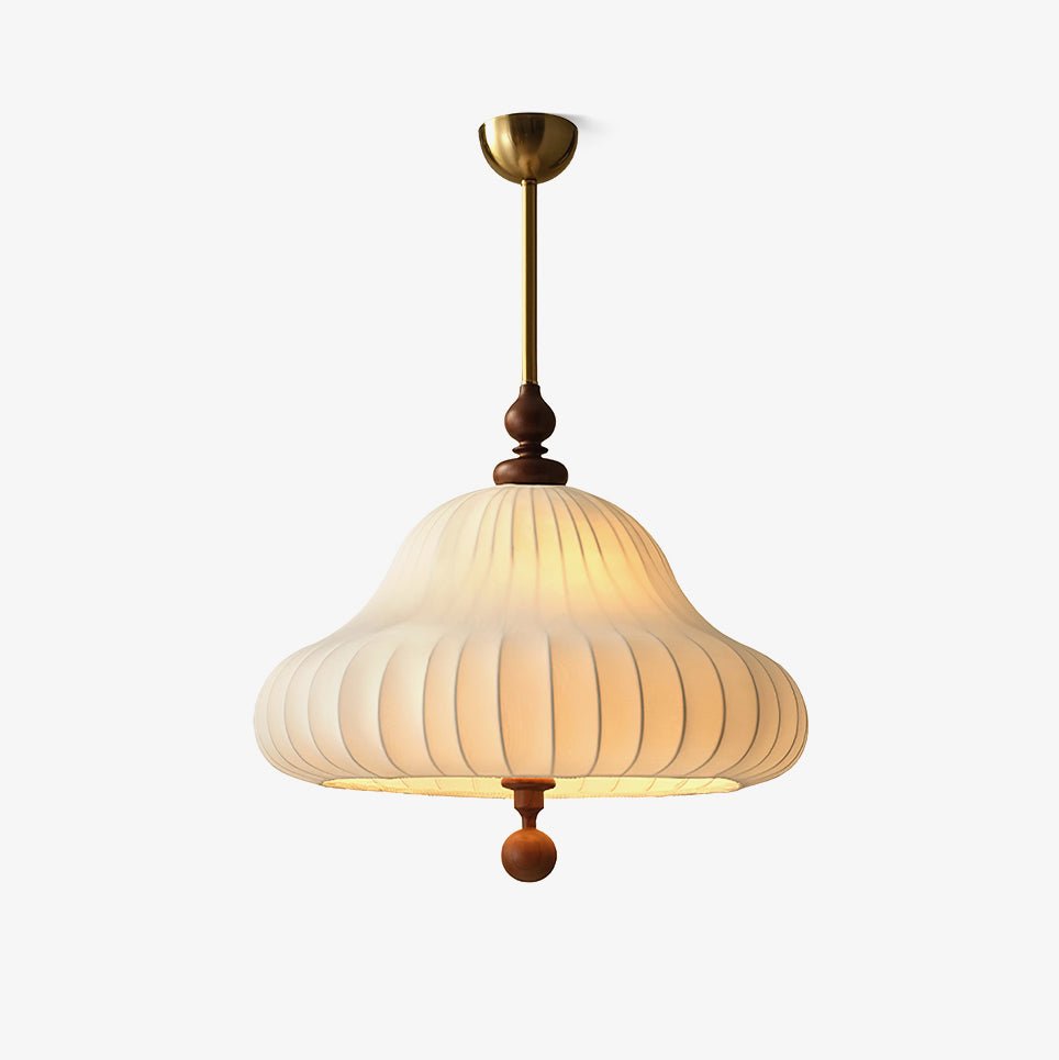 A Clérachic pendant on a plain light backdrop, with a brass canopy and rod, a walnut turned finial and a white pleated bell shade.