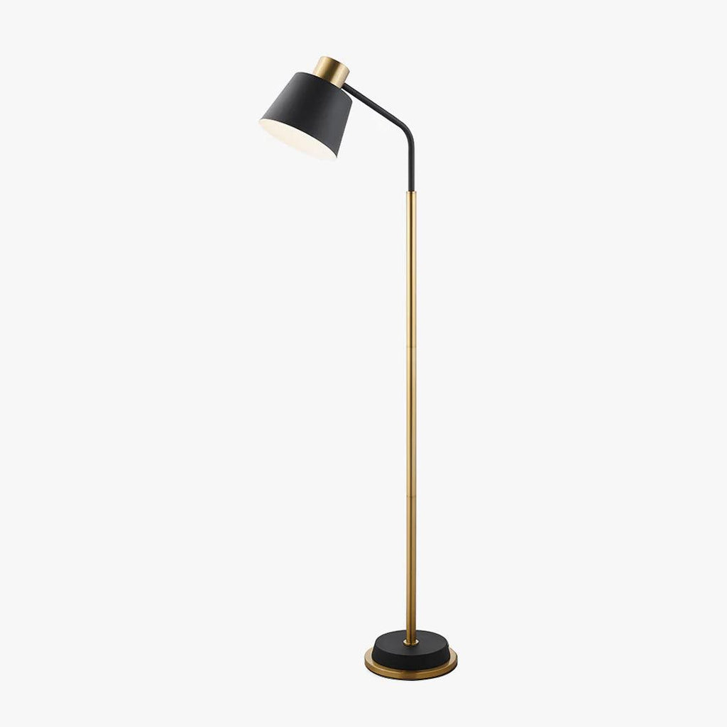 Floor lamp from Clérachic with a black conical shade on a curved arm, a gold slim stem and a black base with a gold rim, on a plain backdrop.