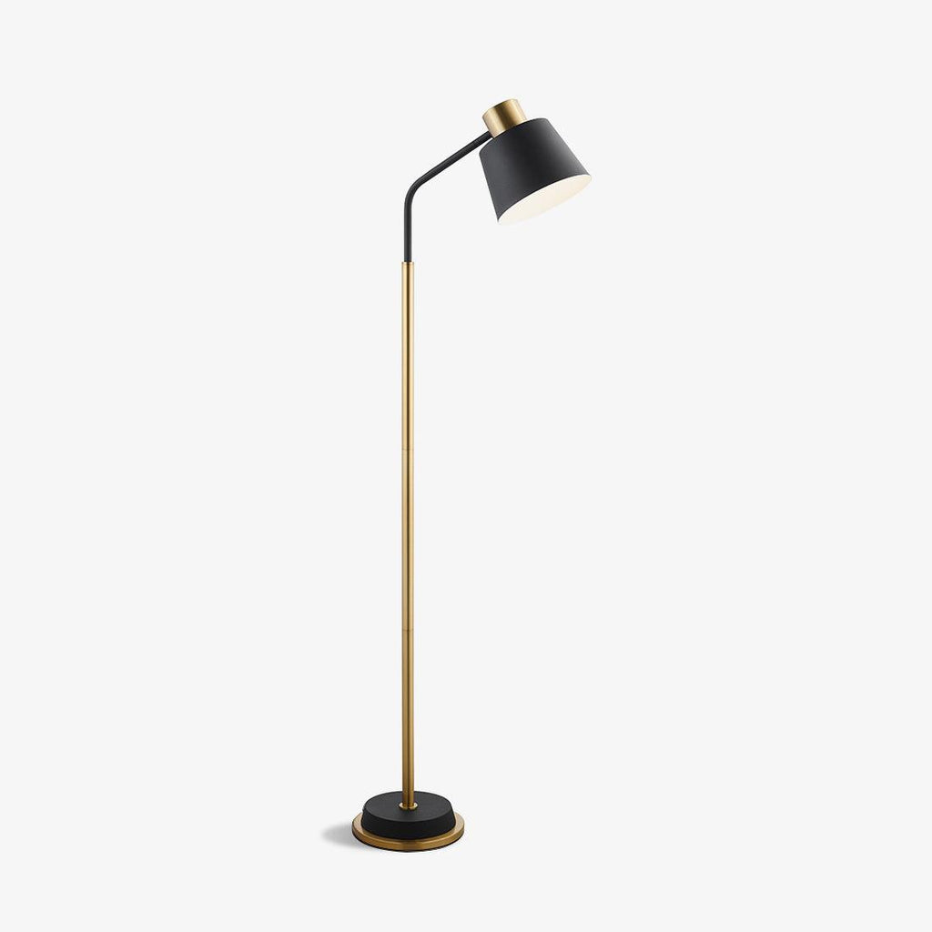 Clérachic floor lamp shown whole on a white backdrop, with a black shade, gold stem and black base with a gold rim.