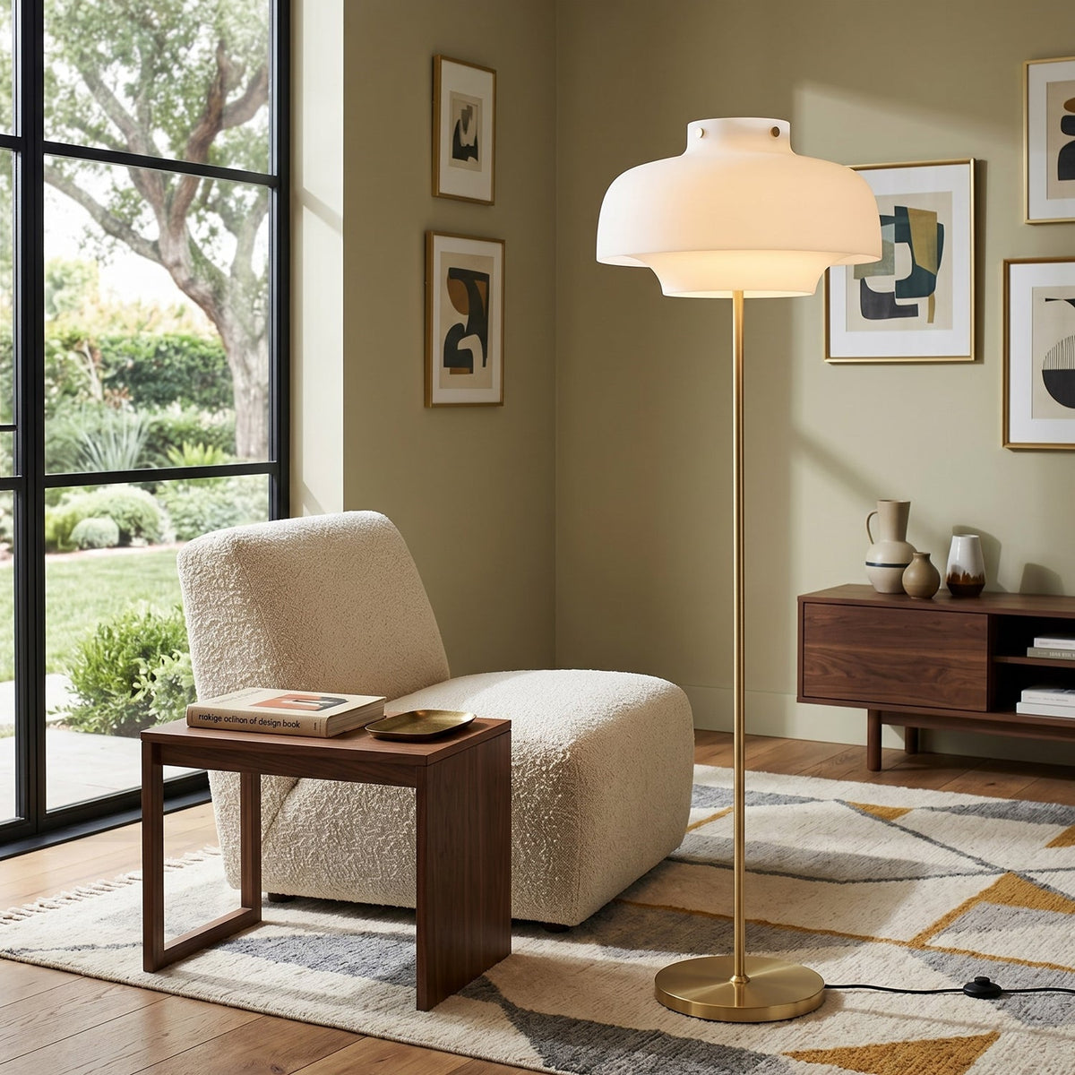 Next to a boucle lounge chair and open glass doors to a garden, this Clérachic floor lamp stands on a patterned rug.