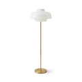 Full-length view of this Clérachic floor lamp on white, its white glass dome atop a thin brass stem and a low round base.