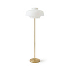Full-length view of this Clérachic floor lamp on white, its white glass dome atop a thin brass stem and a low round base.