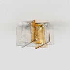 Unlit Clérachic ceiling light with overlapping clear and amber glass panes, photographed from below against a light grey ceiling.