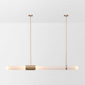 This Clérachic pendant light on a soft white backdrop, a long frosted tube hung level from two gold rods with a woven centre band.