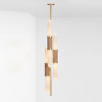 The vertical form of this Clérachic pendant light, staggered frosted tubes with woven gold bands, hung from a single gold rod.