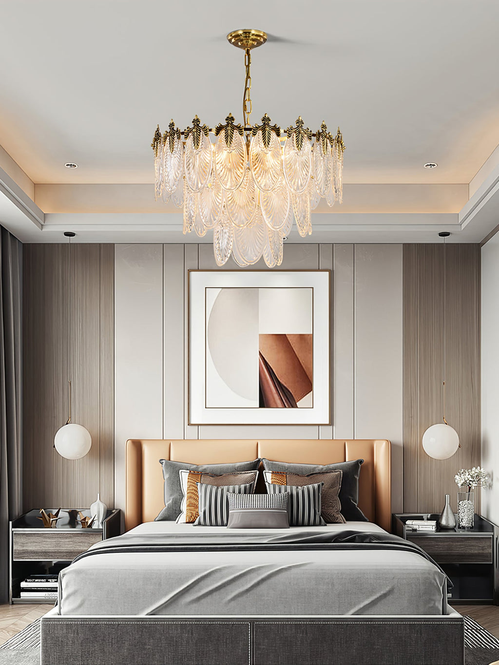 Clérachic leaf chandelier lit above a bed with a tan headboard and grey bedding, in a bedroom with a recessed ceiling and framed art.