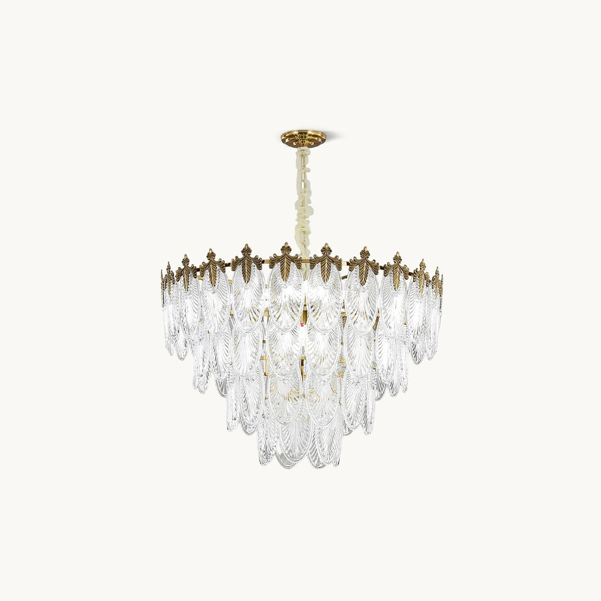 Unlit Clérachic chandelier on a cream backdrop, with four stepped tiers of clear glass leaves under a gold crown and canopy.