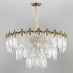 Wide unlit Clérachic chandelier on a grey backdrop, showing three tiers of clear ribbed glass leaves beneath a gold crown.