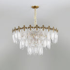 Broad, shallow three-tier Clérachic chandelier on a grey backdrop, with clear glass leaves and a gold crown, unlit.