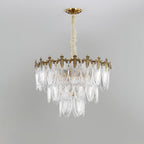 Tall four-tier Clérachic chandelier on a grey backdrop, its clear glass leaves narrowing towards the bottom, unlit.