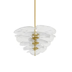 Clear glass Clérachic chandelier with gold fittings on white, its translucent petals layered around a brass rod.