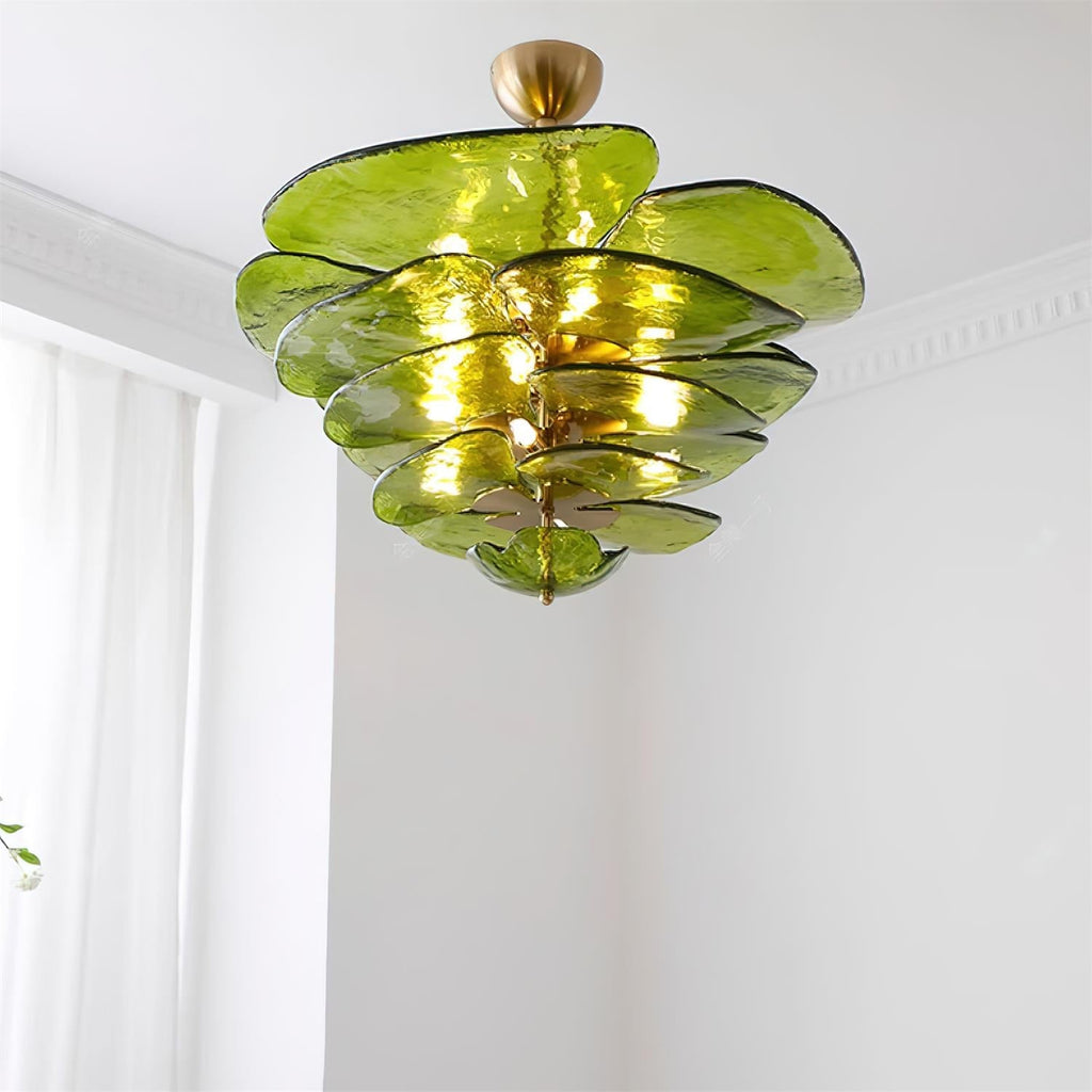 Green and gold Clérachic chandelier lit below a white ceiling, its rippled olive glass petals layered in tiers.