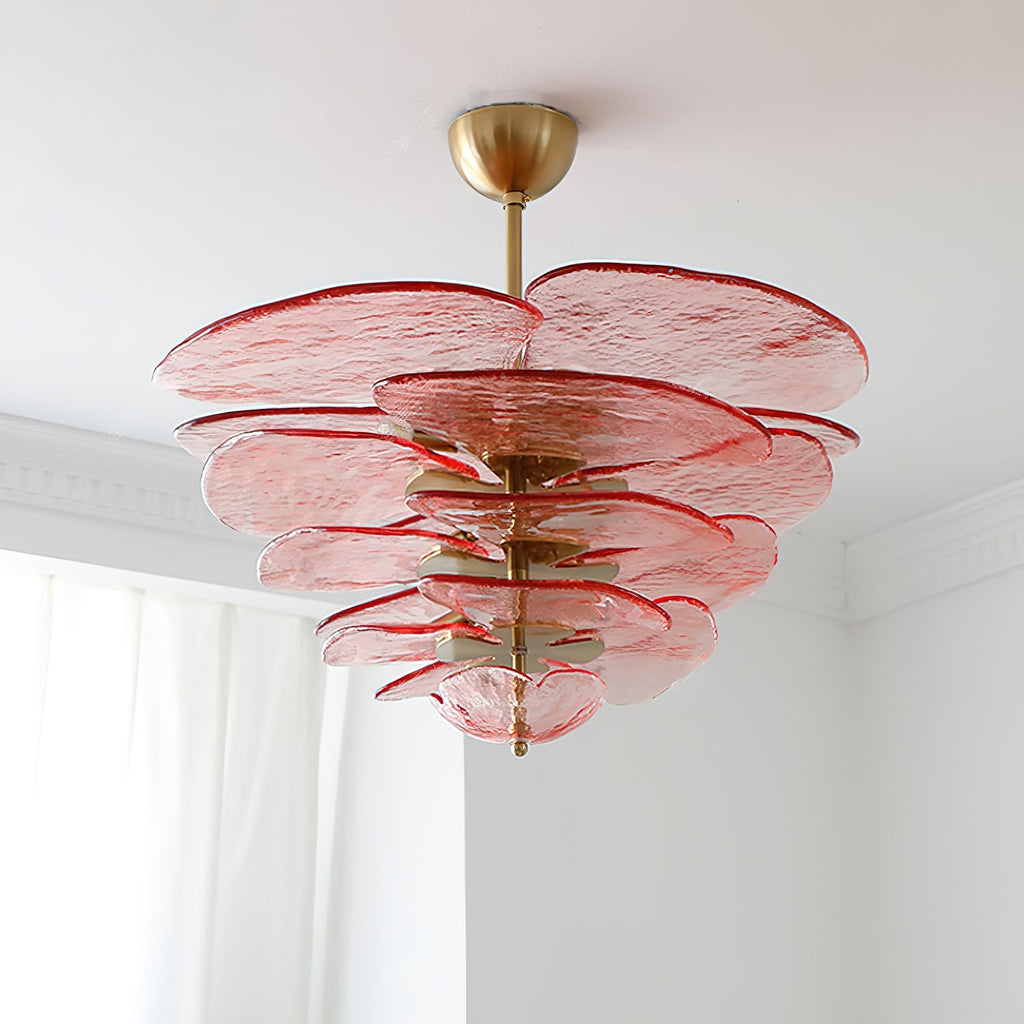 Pink Clérachic chandelier seen from below against a white ceiling, with red-edged glass petals stacked around a brass spindle.