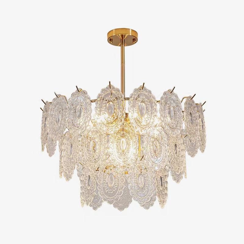 Clérachic gold-framed pendant with three tiers of oval, textured clear glass panels, photographed on a plain light backdrop.