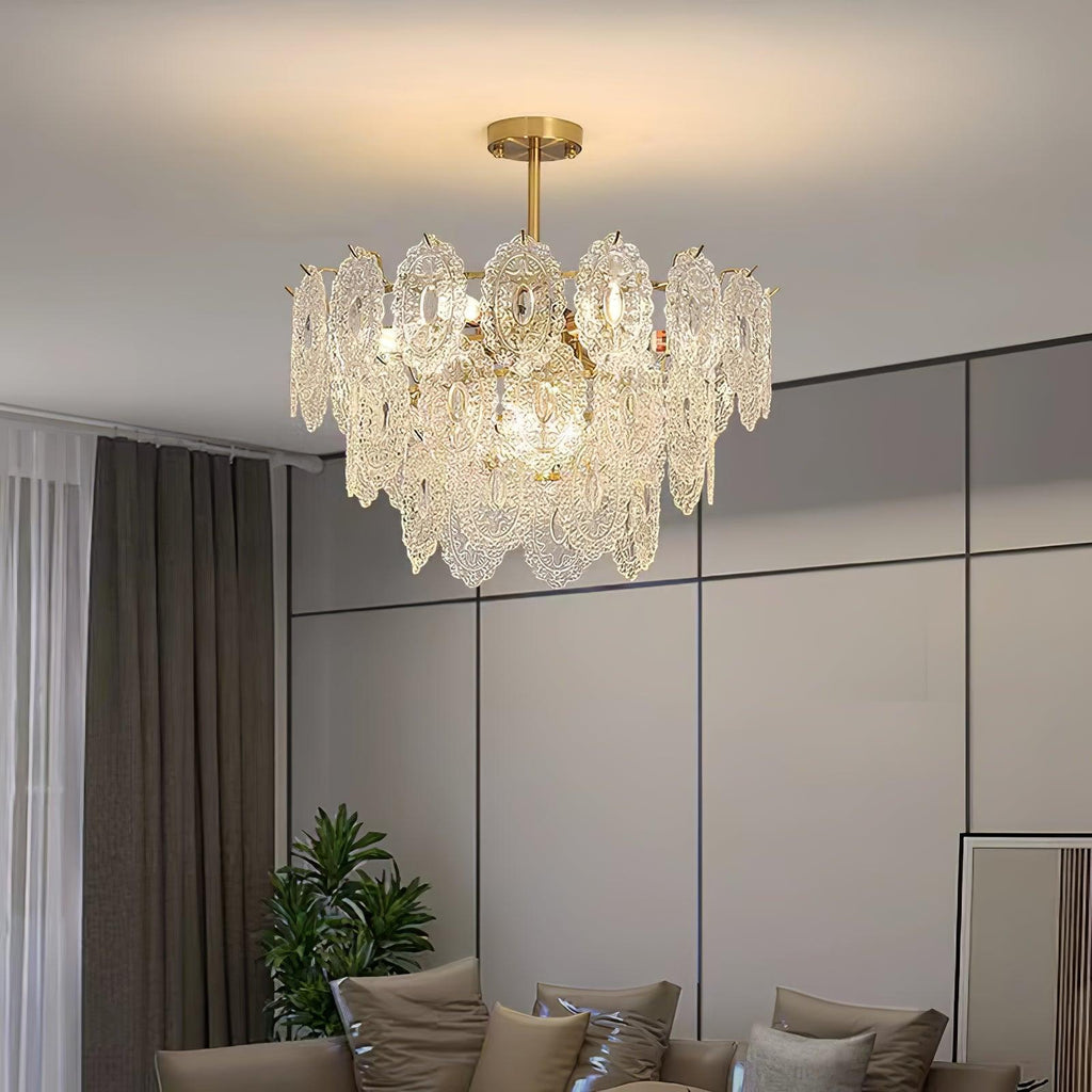 Clérachic pendant glowing above a grey sofa with brown cushions, with dark curtains and a panelled grey wall behind.