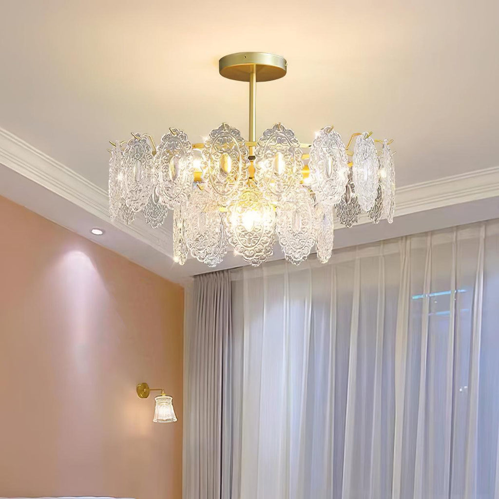 Clérachic glass pendant under a white cornice in a bedroom, with sheer curtains and a pink wall and wall light beside it.