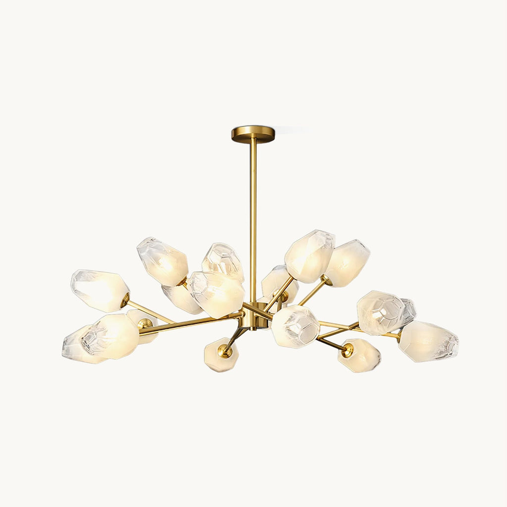 Gold-finished chandelier with frosted faceted glass shades on branching arms, this Clérachic ceiling light shown on a plain cream backdrop.