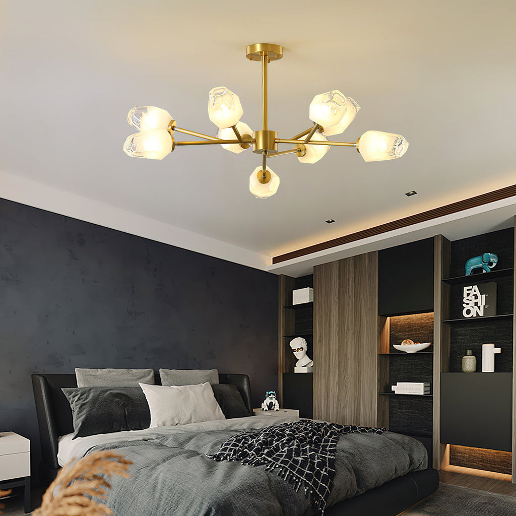 This Clérachic chandelier hanging in a dark bedroom with a recessed ceiling edge, a charcoal bed and wood shelving behind.