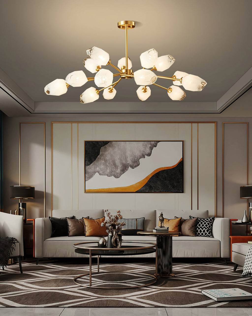 Clérachic chandelier lit in a living room with a coffered ceiling edge, a cream sofa and a framed abstract artwork.
