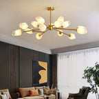 Wide, flat Clérachic chandelier in brass and frosted glass above a brown leather sofa in a dark panelled room.
