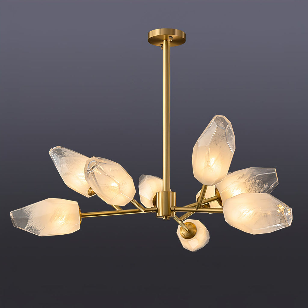 Six-shade Clérachic chandelier with a long brass rod, lit against a deep grey-blue studio backdrop.