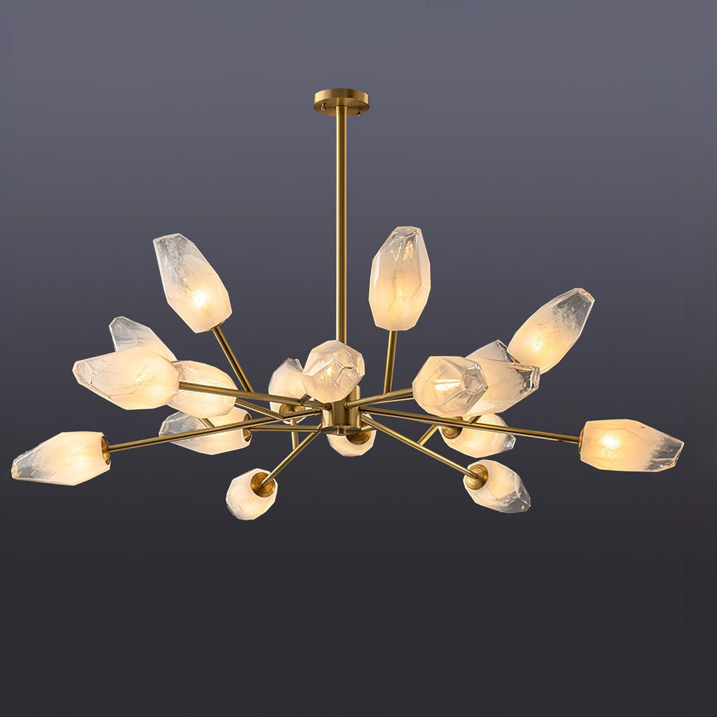 A Clérachic chandelier with many warmly lit frosted shades spread wide on a dark grey-blue studio backdrop.