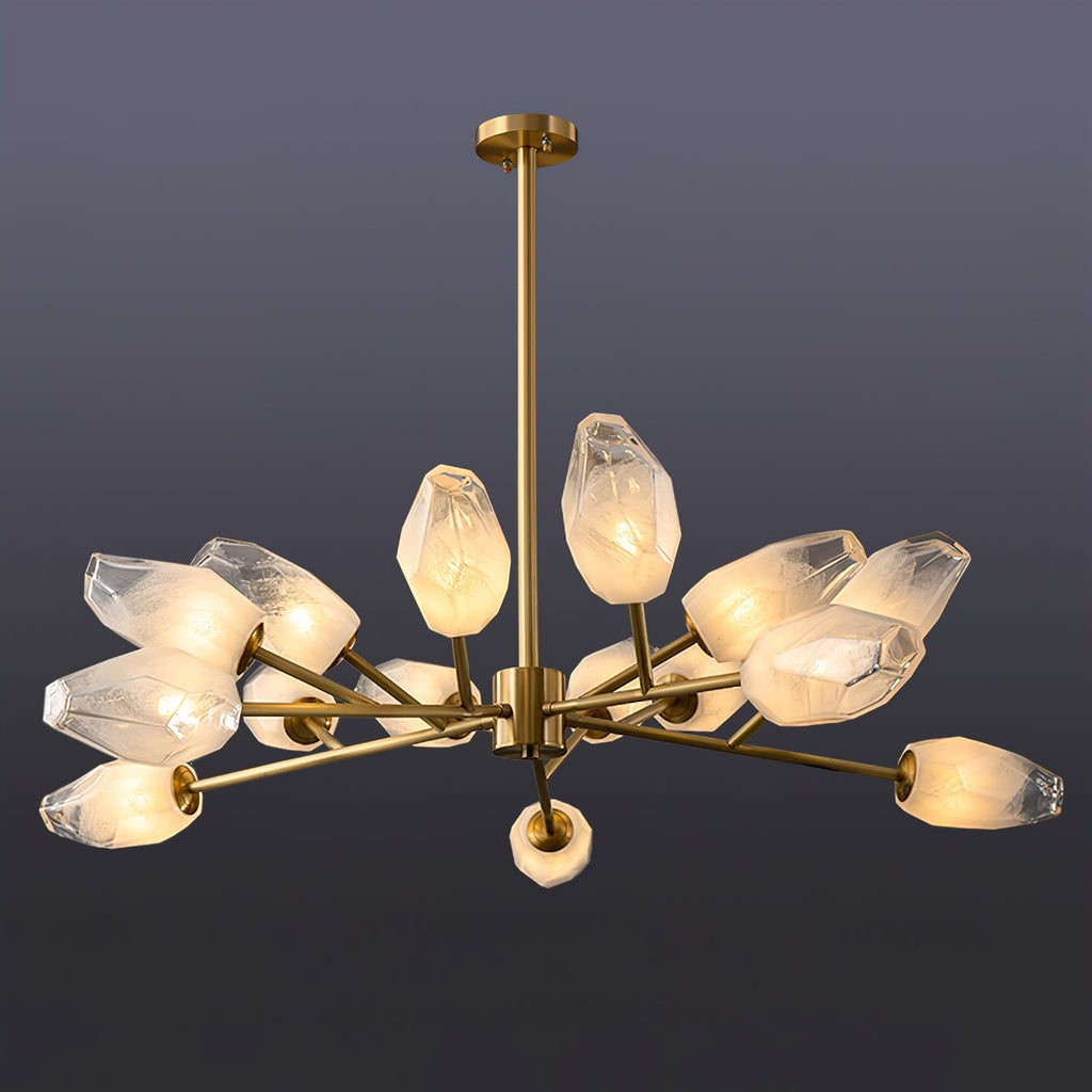 Fuller Clérachic chandelier with a brass rod and a cluster of lit frosted shades, on a dark slate backdrop.