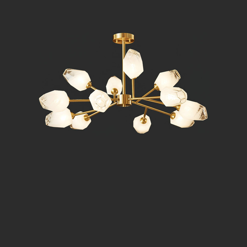 A Clérachic chandelier with a dozen lit frosted shades on a brass frame, on a charcoal studio background.