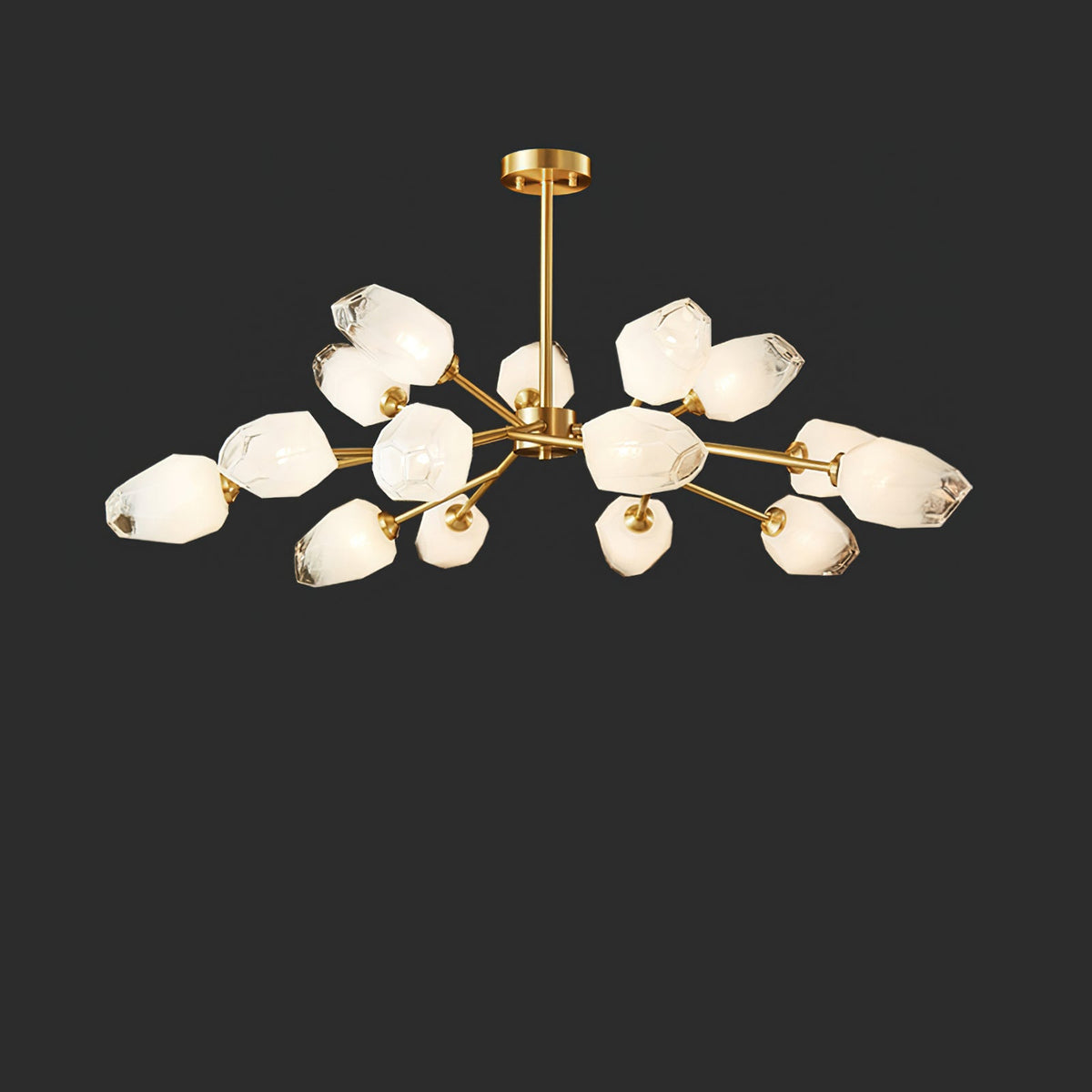 Clérachic chandelier with around fifteen lit frosted shades on a brass frame, on a charcoal studio background.