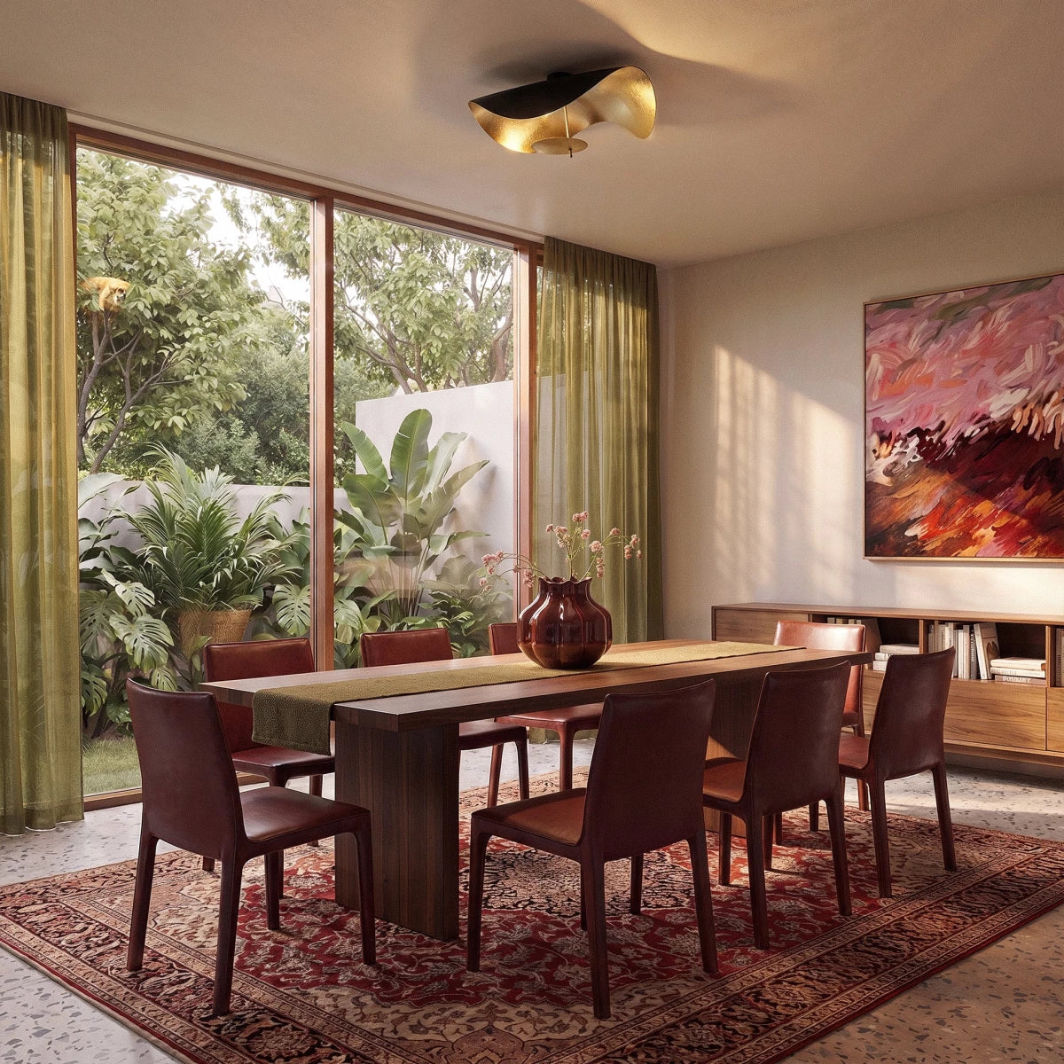 Over a wooden dining table, the black-and-gold Clérachic ceiling light adds a sculptural focal point to the room.