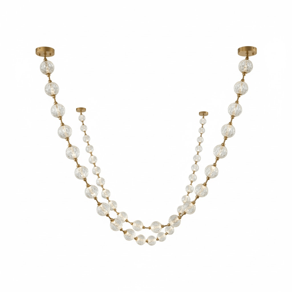 Two strands of this Clérachic pendant with larger spheres at the top and smaller beads below, on a white backdrop.