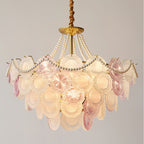 Wide view of the Clérachic pendant lit, with its widest tier of glass discs and a pearl swag looping from the canopy.