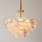 Clérachic pendant lit against grey, its pearl swags looped above overlapping pink, clear and frosted glass discs.