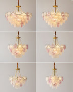 Six small views of a Clérachic pendant, lit and unlit, from different angles, with pearl strands and pink and frosted glass discs.