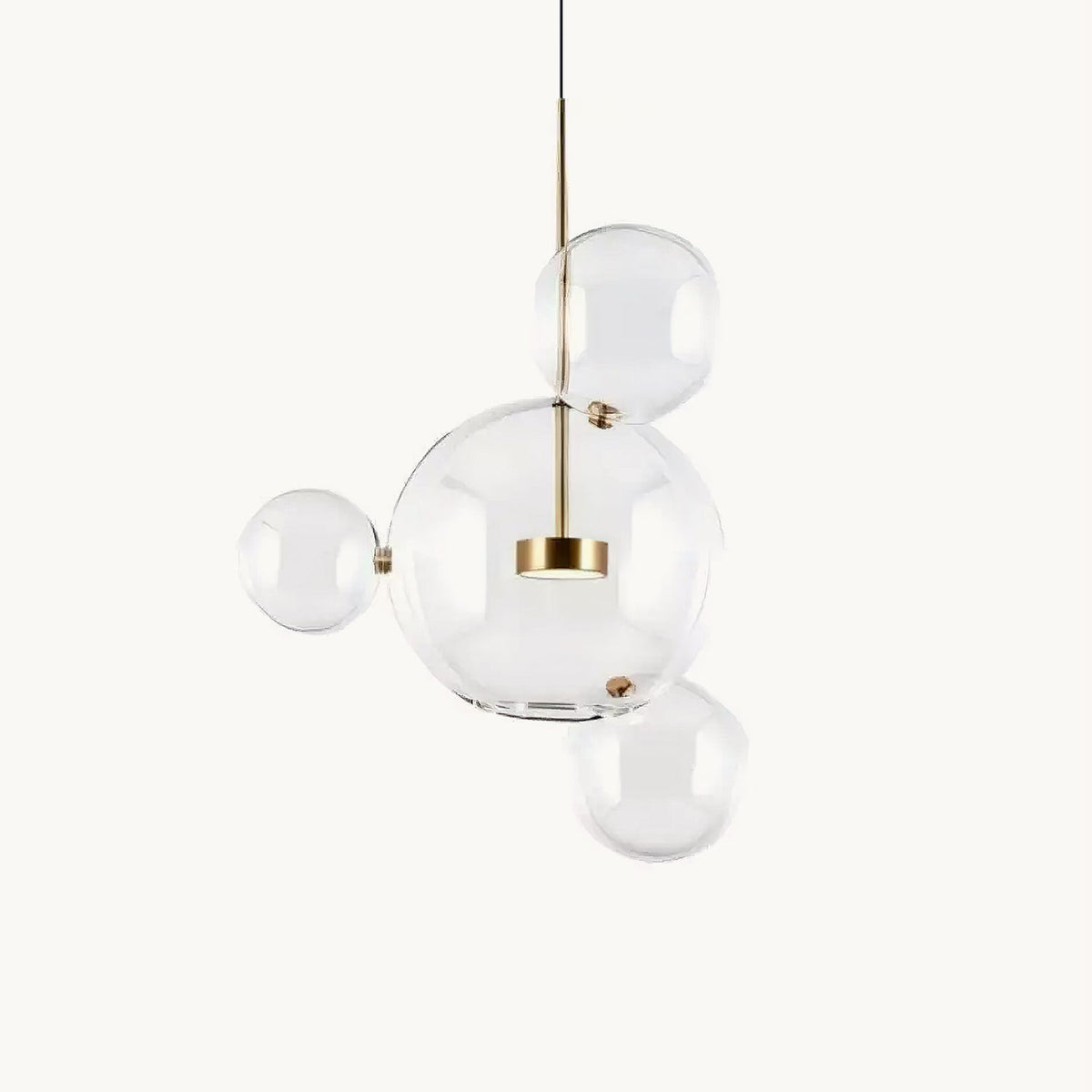 Clérachic glass sphere pendant with a large clear globe and three smaller spheres around a gold central disc, on a plain white backdrop.
