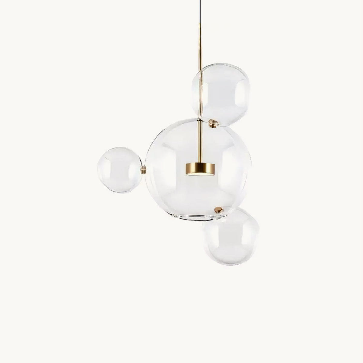 Clérachic glass sphere pendant with a large globe and three small spheres on a gold stem, on a cream backdrop.