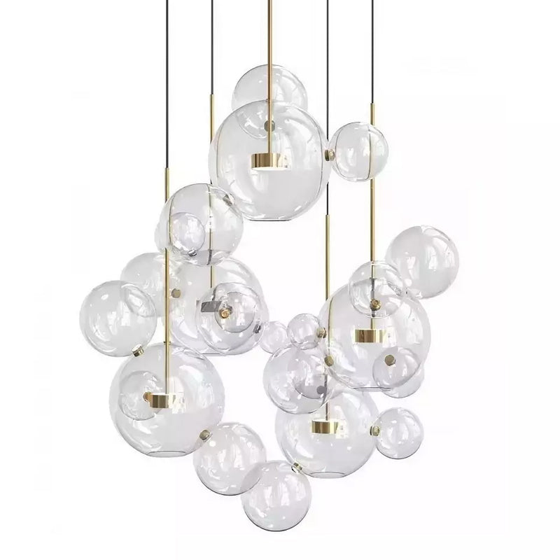 Large Clérachic glass sphere installation with many pendants and clear spheres of mixed sizes, on a white backdrop.