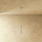 Clérachic unlit teardrop pendant with a brass cone cap and bubbled clear glass drop on a fine cable and slim canopy.