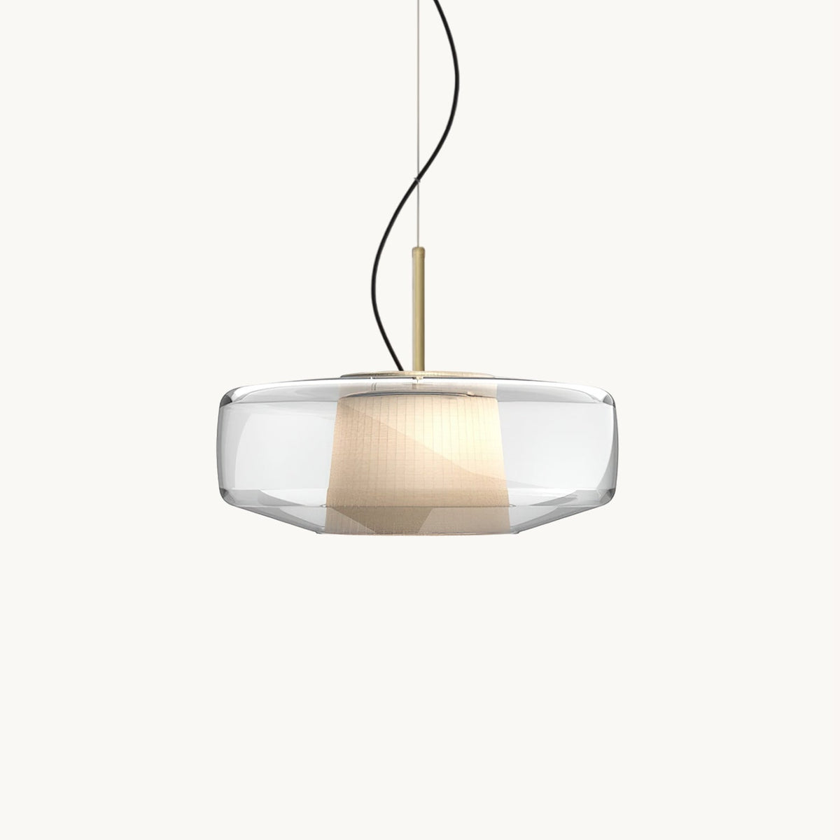 A Clérachic pendant with a wide clear glass shade, a pleated white inner shade and a brass stem, on a plain white backdrop.
