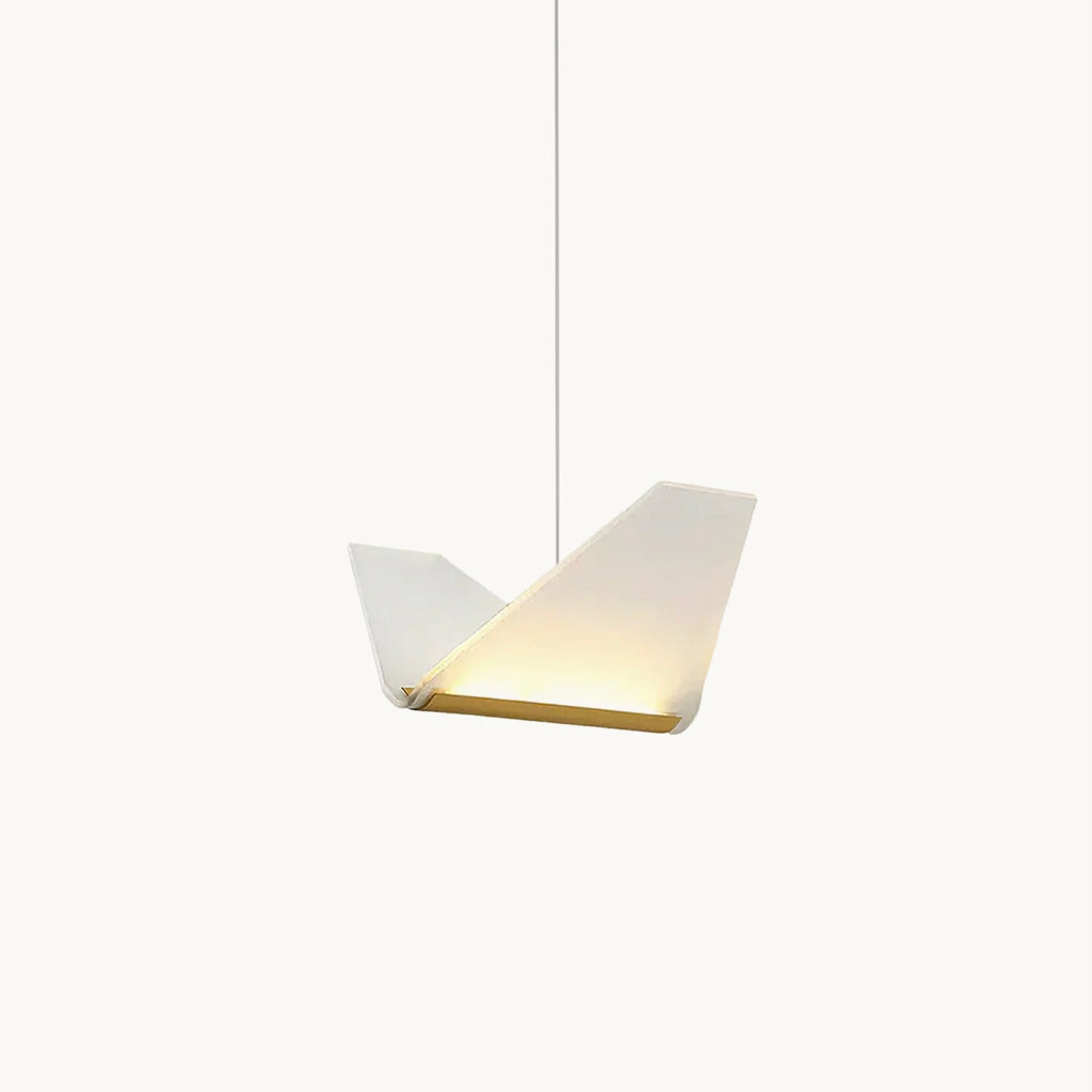 A Clérachic pendant light on a plain white backdrop, a folded white shade with a gold edge strip glowing along its lower fold.