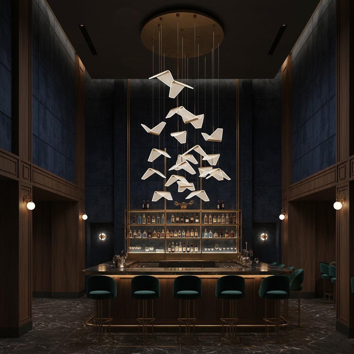 Folded shades from this Clérachic pendant light float above a dark bar with green stools, under a round gold ceiling plate.