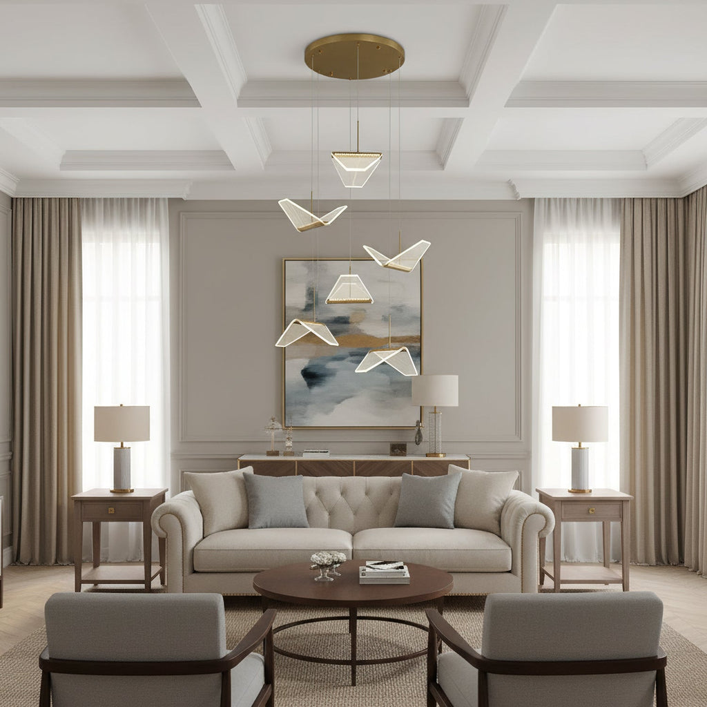 In a coffered-ceiling sitting room, this Clérachic pendant light hangs folded shades above a cream sofa and a round table.