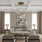 In a coffered-ceiling sitting room, this Clérachic pendant light hangs folded shades above a cream sofa and a round table.