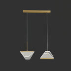 Two angular shades from this Clérachic pendant light hang from a long gold bar on two fine cords, on a dark backdrop.
