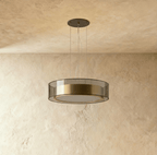 A closer angle of the Clérachic pendant light, its smoked glass drum catching light from below.