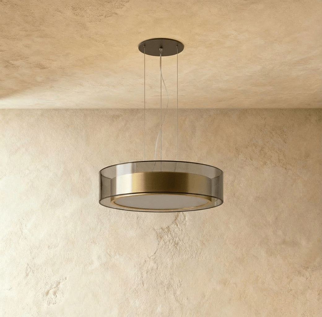 A closer angle of the Clérachic pendant light, its smoked glass drum catching light from below.
