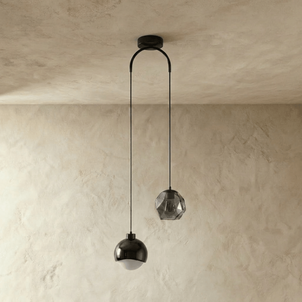 Clérachic pendant light in black, dome and faceted-glass shades on an arched ceiling canopy, unlit.