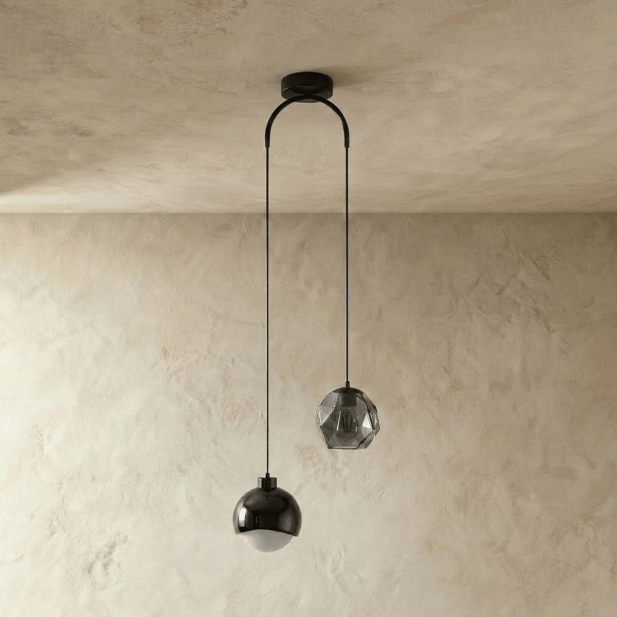 Clérachic pendant light in black, dome and faceted-glass shades on an arched ceiling canopy, unlit.