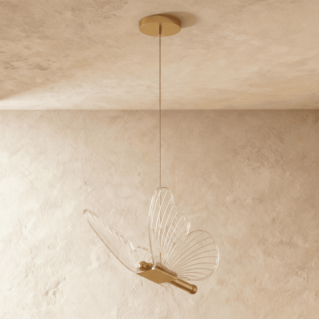 Clérachic brass butterfly pendant light with translucent ribbed wings, suspended from a round brass ceiling canopy.